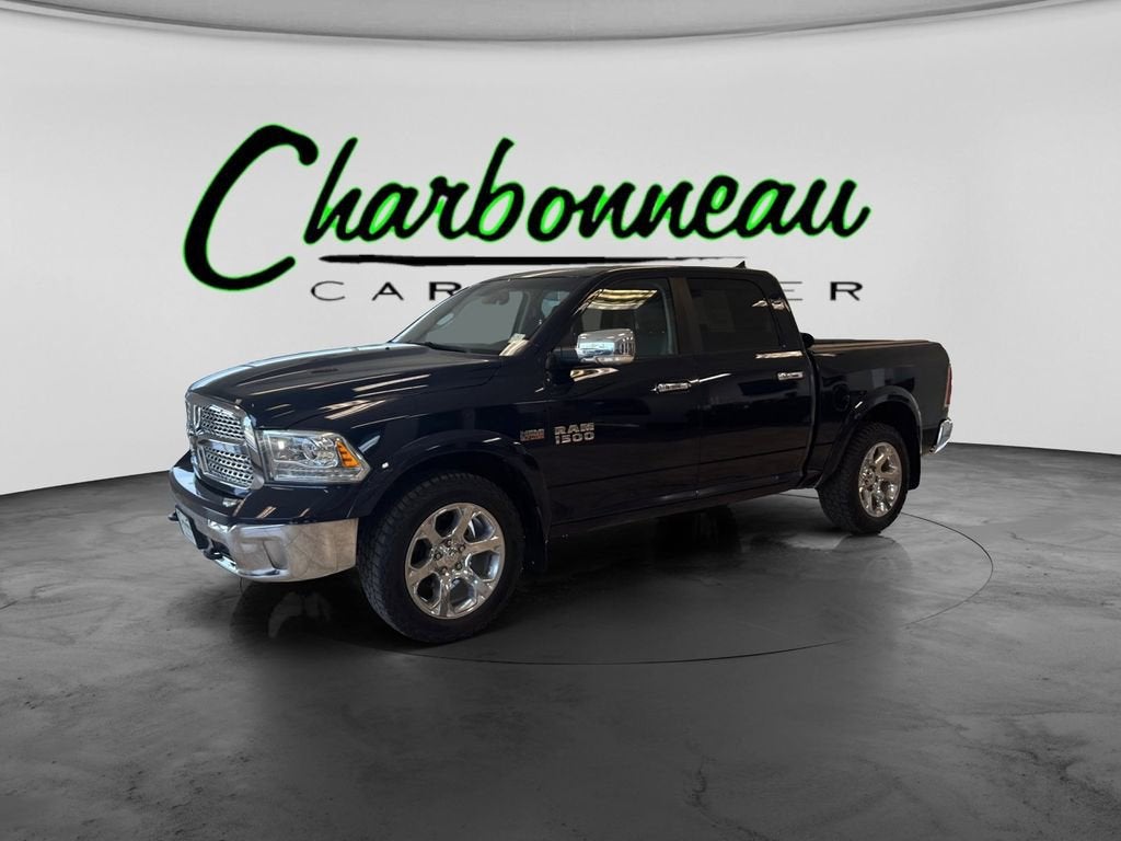 2015 RAM 1500 Laramie in Blue — front three-quarter view