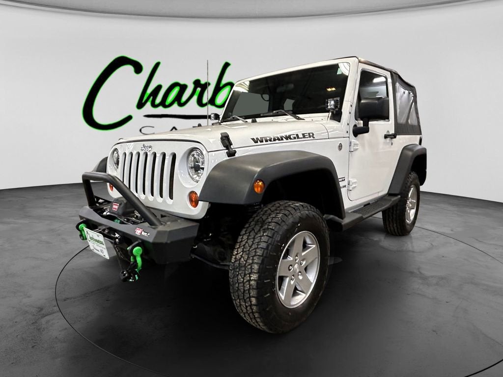 2011 Jeep Wrangler Sport in White — front three-quarter view